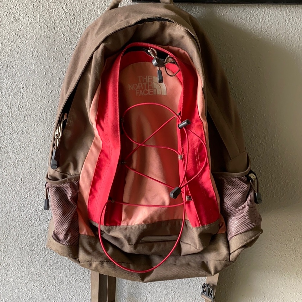 Pink and tan The North Face backpack.